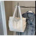 Ivory corduroy tote bag with canvas handles and magnetic buckle pocket detail - White