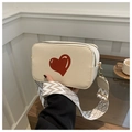 Chic beige heart camera bag with stylish patterned woven crossbody shoulder strap - Off White