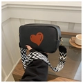 Black pebble leather camera bag with red heart and wide geometric woven strap - Black