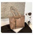 Detail shot of khaki tote bag texture with vintage woven rope and golden bell pendant - Khaki (With Charm)