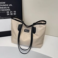 Minimalist beige nylon tote bag with black contrast straps and leather patch detail - White & Black