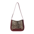 Leopard print crossbody bag with red leather trim and shoulder strap on white background - Burgundy