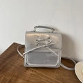 Silver metallic mini backpack with bow detail and transparent front mesh pocket - Silver