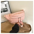 Detail of pink PU leather fanny pack showing dual zippers and smooth textured surface - Pink