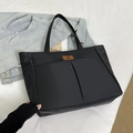 Large black nylon tote bag with front twin pockets and stylish brown leather logo patch - Black