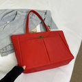 Large red nylon tote bag with dual front pockets and shoulder straps for daily commute - Red