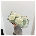 Detail of light green corduroy crossbody bag featuring cargo pockets and blue plush charm - With Pendant / Green
