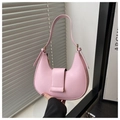 Close-up of pink crescent underarm bag with gold hardware and magnetic flap closure - Pink
