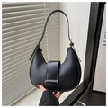 Detail of matte black crescent bag with golden metal trim and adjustable strap - Black