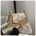 Detail of Chinese style shoulder bag showing wave pattern embroidery on the flap cover - Khaki