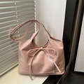 Pink faux leather tote bag featuring a decorative bow and soft minimalist texture - Pink