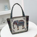 Ethnic elephant tote bag featuring colorful embroidery and geometric stripe accents - Off-White Side Elephant