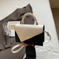 Chic black and white contrast leather handbag with woven handle and gold metal detail - Off White