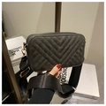 Detail of grey V-quilted crossbody bag with wide strap and gold hardware - Black