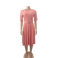 Close-up of pink pleated dress featuring a crew neck and matching square buckle belt - S / Pink