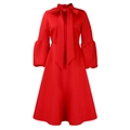Detailed view of the red cocktail dress with lantern sleeves and a bow neckline - S / Red