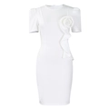 Detail of elegant white bodycon dress featuring 3D floral accent and ruffle trimming - White