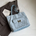 Light blue tote bag with butterfly buckle and pleated texture in casual style - Basic Style / Blue