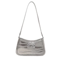 Borsa a spalla argento con fiocco e motivo coccodrillo effetto metallico 2025 - Argento