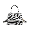 Mini zebra print handbag with top handle and gold hardware on white background - White