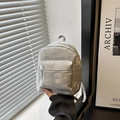 Minimalist silver mini backpack with metallic texture and adjustable straps for daily commute - No Pendant / Silver