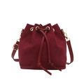 Minimalist burgundy suede drawstring bucket bag with gold hardware and shoulder strap - Red