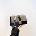 Chic two-tone crossbody bag with black leather, grey texture and gold chain strap - Black