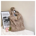 Detail of hollow knit tote bag featuring white pearl beads and textured diamond pattern - Khaki