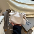 White faux leather dumpling crossbody bag with pleated design and thin shoulder strap - No Pendant / White