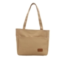 Khaki canvas tote bag with front pocket and brown leather logo patch on white background - Khaki
