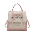 Mini zaino rosa e bianco con decorazione a fiocco e ciondolo a cuore su sfondo bianco - Bianco e Rosa
