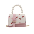 Pink and white crossbody bag with cherry print, pearl handle and golden chain strap - Pink