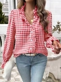 Detail showing the ruffled stand collar and red checkered pattern of the women's blouse - S / Red