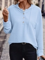 Detail of light blue hooded jacket featuring unique horizontal pleated texture and buttons - Light Blue