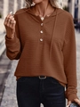 Detail of brown pleated hoodie featuring a three-button neckline and textured fabric - Coffee