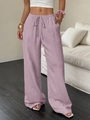 Detail of lavender high waisted wide leg pants featuring textured fabric and side pockets - S / Bottoms / Pink