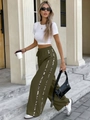 Detalle del pantalón ancho oliva con cordón y paneles laterales con estampado de leopardo - S / Verde Militar