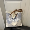 Blue and white canvas summer tote bag with fringe detail and brown leather handles - Blue