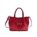 Red woven leather bucket bag with top handles and adjustable shoulder strap on white backdrop - Red