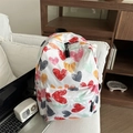 Artistic graffiti heart print backpack for students on a cozy white sofa setting - Colorful Heart Print (Pattern 2)