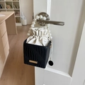Detail of a mini box bag with black woven texture, white drawstring and pearl handle - Black