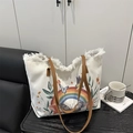 White canvas tote bag with butterfly prints and vintage frayed edges and brown handles - White