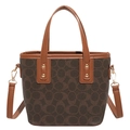 Classic dark brown tote bag with monogram pattern and tan leather trim features - Brown
