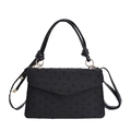 Luxuriöse schwarze Handtasche mit goldener Hardware und gepunktetem Stoffdesign - Schwarz