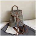 Detailed view of the dark grey matte canvas backpack with brown leather trim and metal hook - Black