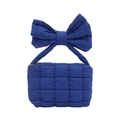 Cobalt blue quilted handbag with a large 3D bow handle and metal zipper closure - Blue