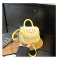 Close-up of mini contrast bag with cherry print on a wooden tray with a shoulder strap - Yellow Without Pendant