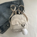 Mini white corduroy backpack with smiley prints and a white fuzzy pom-pom charm - White