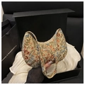 Close-up of floral tapestry shoulder bag presented in a luxury gift box packaging - Pink