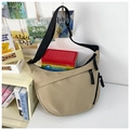 Detail of khaki crescent crossbody bag with durable fabric and woven zipper pull - Khaki